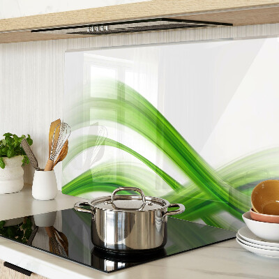 Glas-Schneidebrett mit grünem abstraktem Wellenmotiv