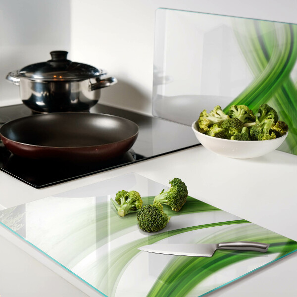 Glas-Schneidebrett mit grünem abstraktem Wellenmotiv
