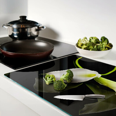 Schneidebrett glas Lilie auf schwarzem Hintergrund