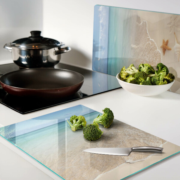 Schneidebrett mit Strandmotiv mit Muscheln und Wellen