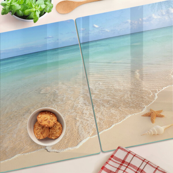 Schneidebrett Strand mit Muscheln und Wellen