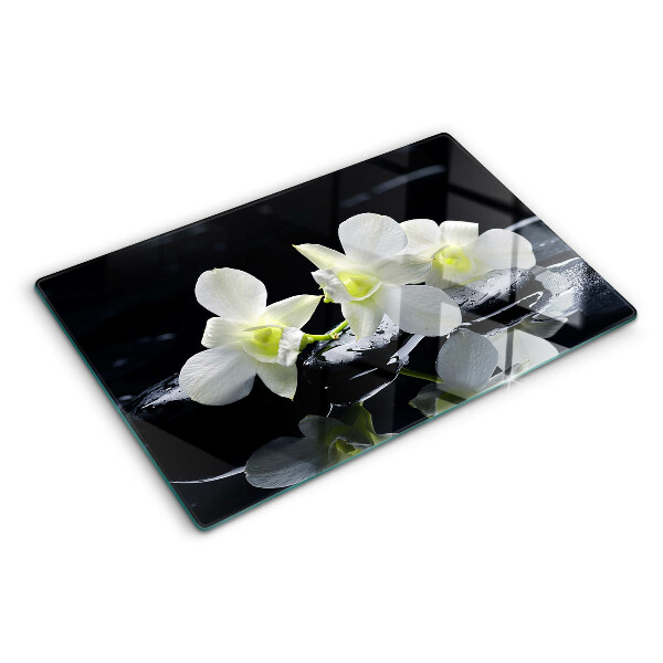 Glas schneidebrett Orchideen auf schwarzem Hintergrund