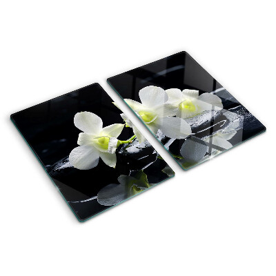 Glas schneidebrett Orchideen auf schwarzem Hintergrund