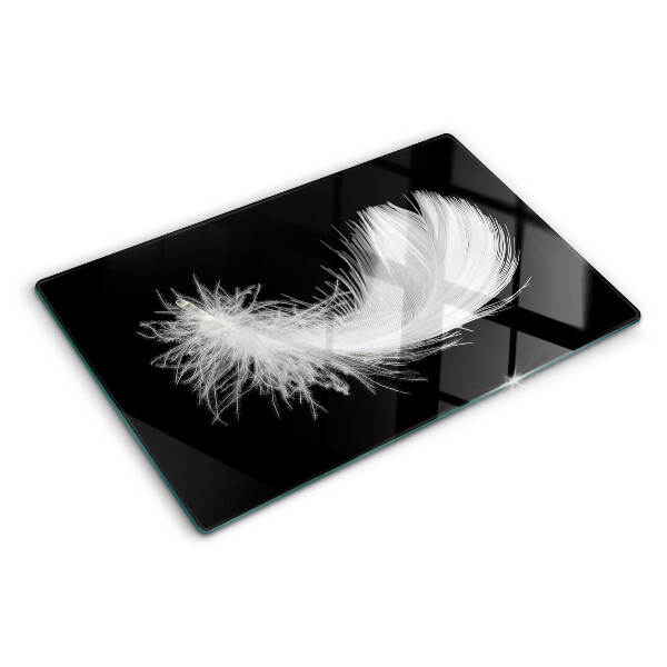 Schneidebrett Glas mit Motiv einer Feder auf schwarzem Hintergrund