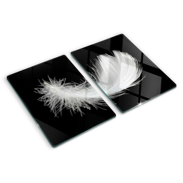 Schneidebrett Glas mit Motiv einer Feder auf schwarzem Hintergrund
