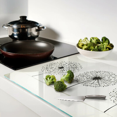 Schneidebrett mit Löwenzahn-Motiv auf weißem Hintergrund