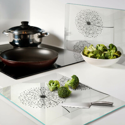 Schneidebrett mit Löwenzahn-Motiv auf weißem Hintergrund