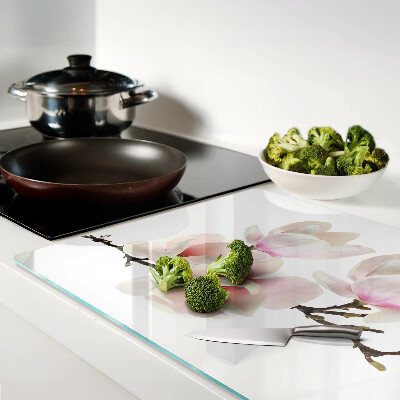 Glas-Schneidebrett mit Motiv von Magnolienblüten an einem Zweig