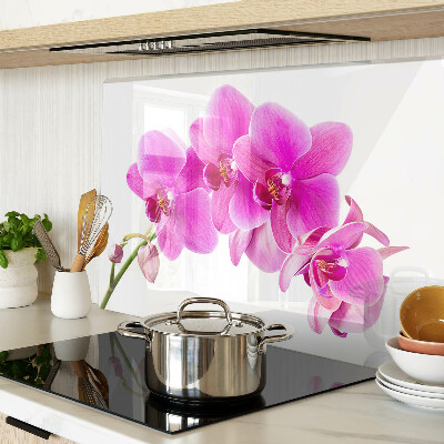 Glas-Schneidebrett mit Orchideen in Rosatönen