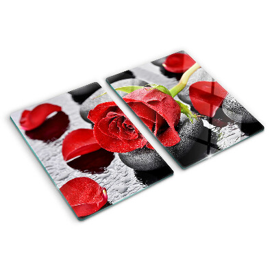 Glas-Schneidebrett mit Motiv einer Rose auf Steinen und Wassertropfen