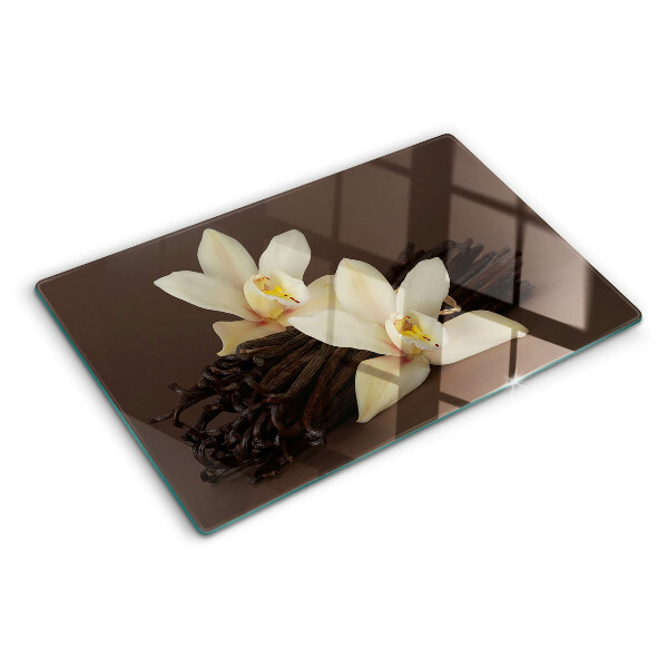 Glas-Schneidebrett mit Orchideen und Vanilleschoten als Motiv