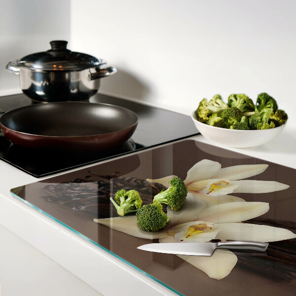 Glas schneidebrett Orchideen und Vanilleschoten