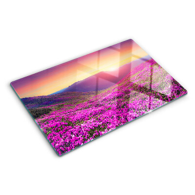 Schneidebrett mit Motiv einer Blumenlandschaft bei Sonnenuntergang