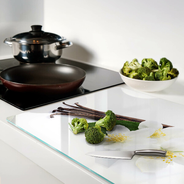 Schneidebrett mit Motiv aus Vanilleblüten und -schoten