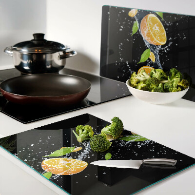 Schneidebrett mit Motiv von Zitrusfrüchten in Wasser