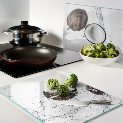 Schneidebrett mit Motiv von Kokosnüssen im Wasser