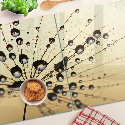 Schneidebrett mit Motiv von Wassertropfen auf einem Spinnennetz