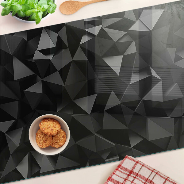 Glas-Schneidebrett mit geometrischem Polygonmotiv in Schwarztönen