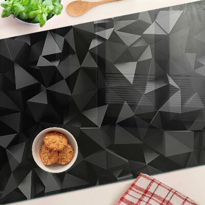 Glas-Schneidebrett mit geometrischem Polygonmotiv in Schwarztönen