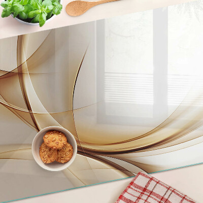 Schneidebrett Glas mit abstraktem Wellenmuster in Beigetönen