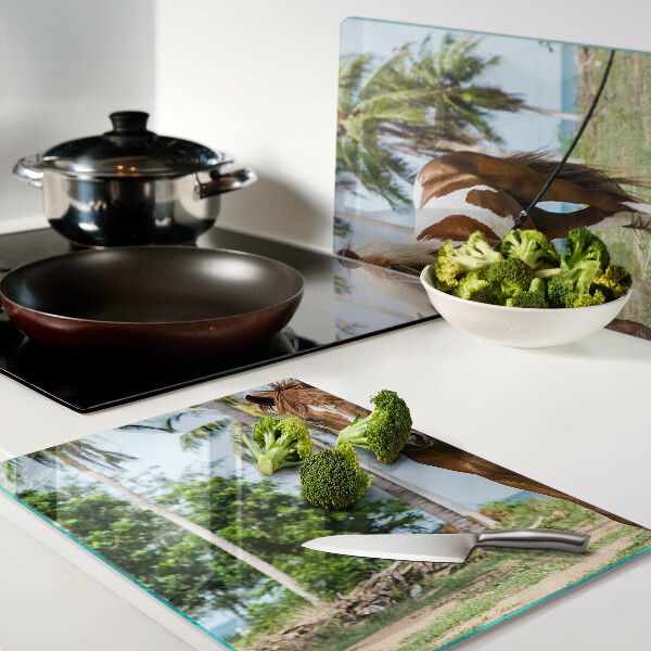 Schneidebrett Glas mit Motiv eines Pferdes vor Palmen im Hintergrund