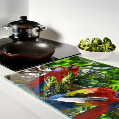 Glas schneidebrett Papageien in einer tropischen Umgebung