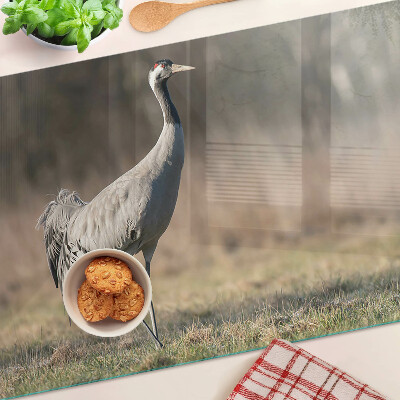 Schneidebrett glas Ein Kran vor der Kulisse einer Landschaft