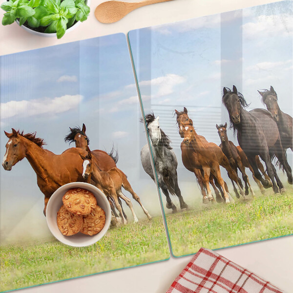 Schneidebrett mit Motiv galoppierender Pferde auf der Wiese