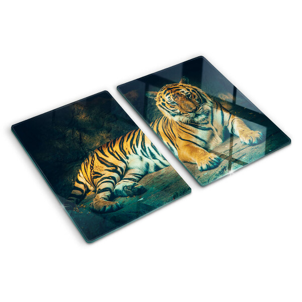 Glas-Schneidebrett mit Motiv eines liegenden Tigers auf Felsen