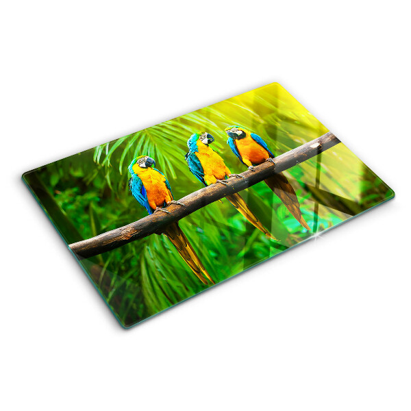 Schneidebrett mit Motiv Papageien auf einem Ast in tropischer Umgebung