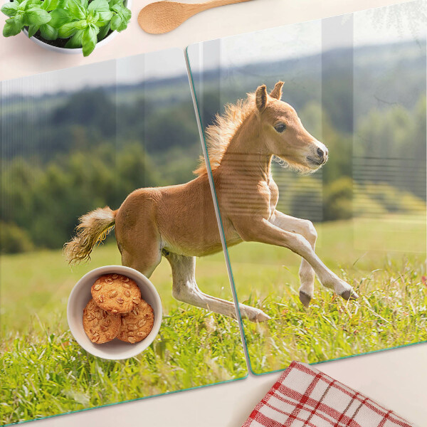 Glas-Schneidebrett mit Motiv Fohlen auf der Wiese