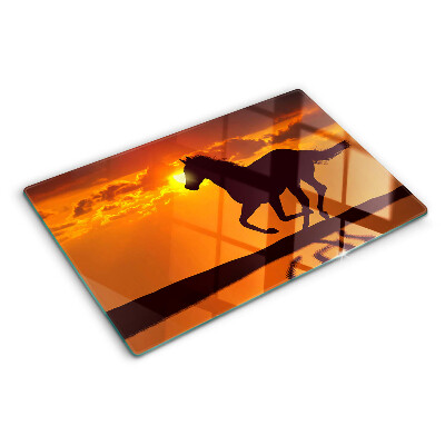 mit Pferdemotiv vor untergehender Sonne