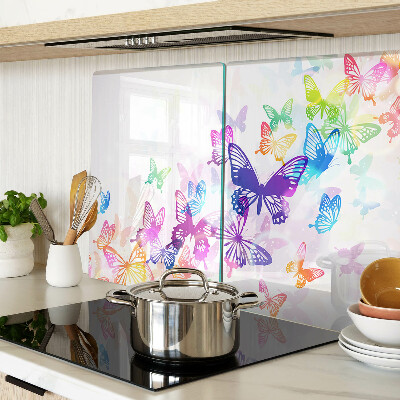 Glas-Schneidebrett mit einem Motiv aus bunten Schmetterlingen, die davonfliegen