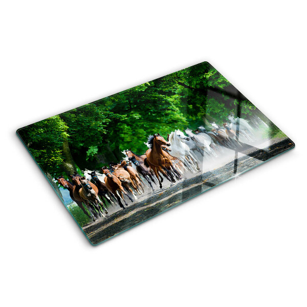 Glas-Schneidebrett mit dem Motiv galoppierender Pferde in natürlicher Umgebung