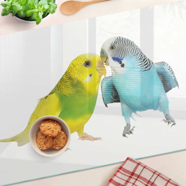 Schneidebrett Glas mit gelbem und blauem Papageienmotiv