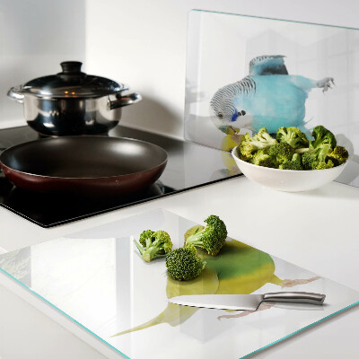 Schneidebrett Glas mit gelbem und blauem Papageienmotiv