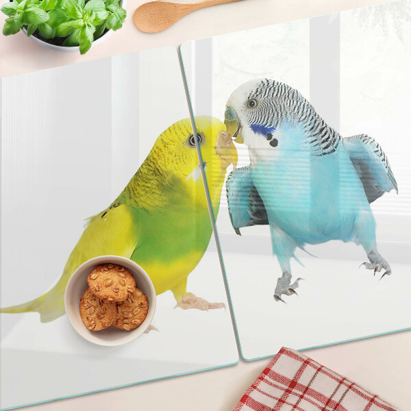 Schneidebrett Glas mit gelbem und blauem Papageienmotiv