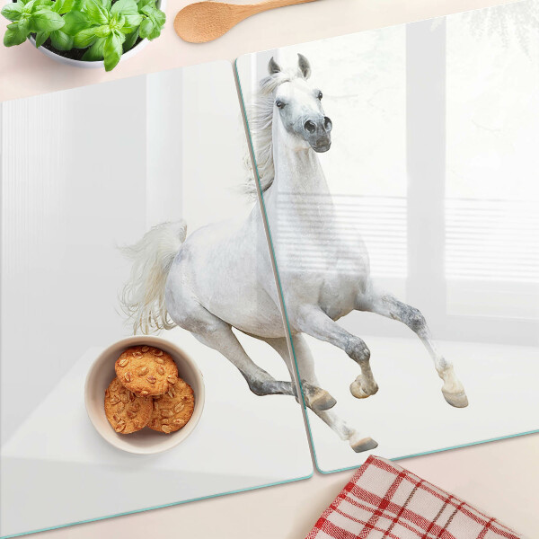 Schneidebrett mit Motiv eines weißen Pferdes in Bewegung