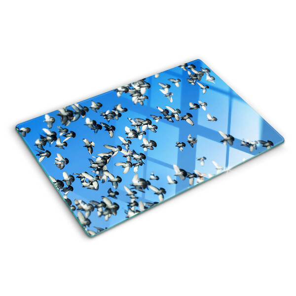 Schneidebrett Glas mit Motiv von Tauben, die am Himmel fliegen