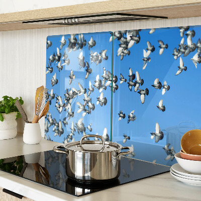 Schneidebrett Glas mit Motiv von Tauben, die am Himmel fliegen