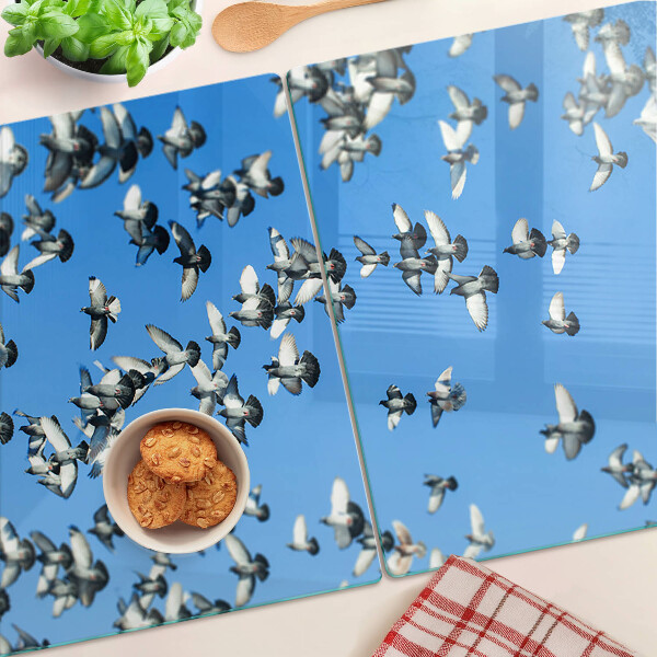 Schneidebrett Glas mit Motiv von Tauben, die am Himmel fliegen