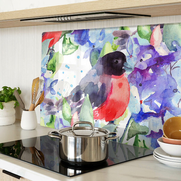 Glas-Schneidebrett mit einem Motiv eines Vogels vor einem Blumenhintergrund