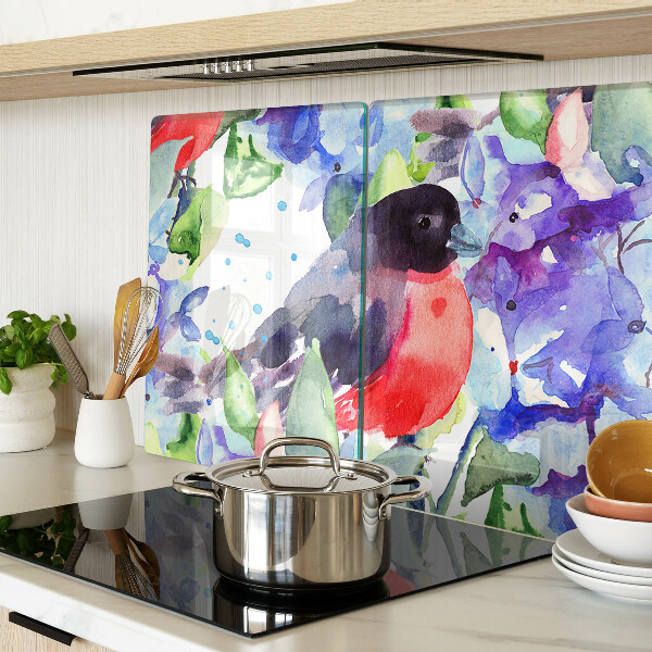 Glas-Schneidebrett mit einem Motiv eines Vogels vor einem Blumenhintergrund