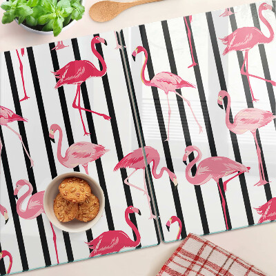 Glas-Schneidebrett mit Flamingos auf gestreiftem Hintergrund