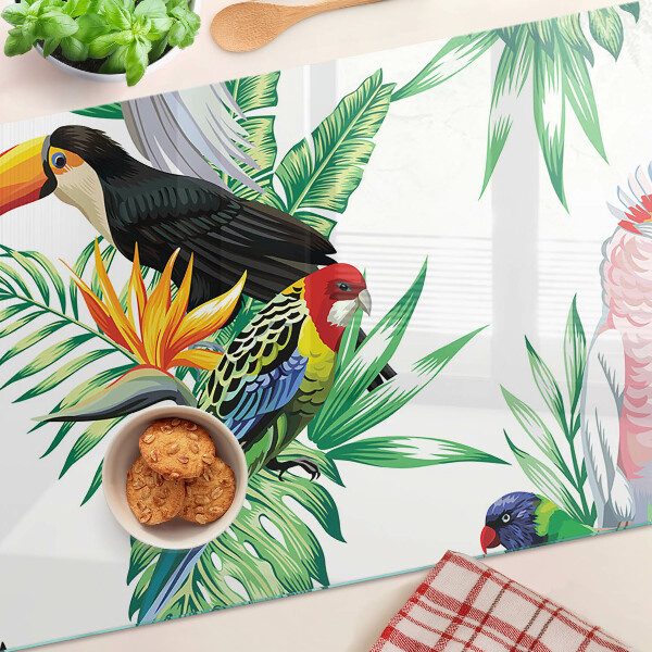 Schneidebrett mit Motiv tropischer Vögel und Blätter
