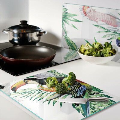 Schneidebrett mit Motiv tropischer Vögel und Blätter