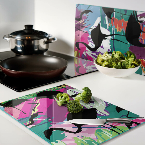 Schneidebrett Flamingos vor farbenfrohem Hintergrund