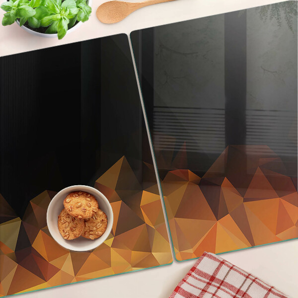 Glas-Schneidebrett mit einem Motiv brennendes Lagerfeuer im geometrischen Stil