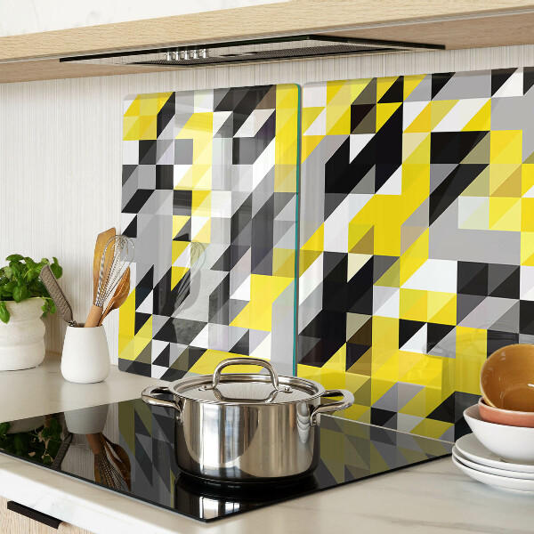 Glas-Schneidebrett mit geometrischem Muster in Gelb- und Schwarztönen