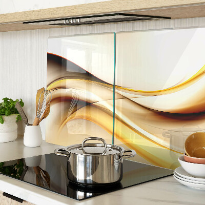Schneidebrett Glas mit abstraktem Wellenmotiv in Goldtönen